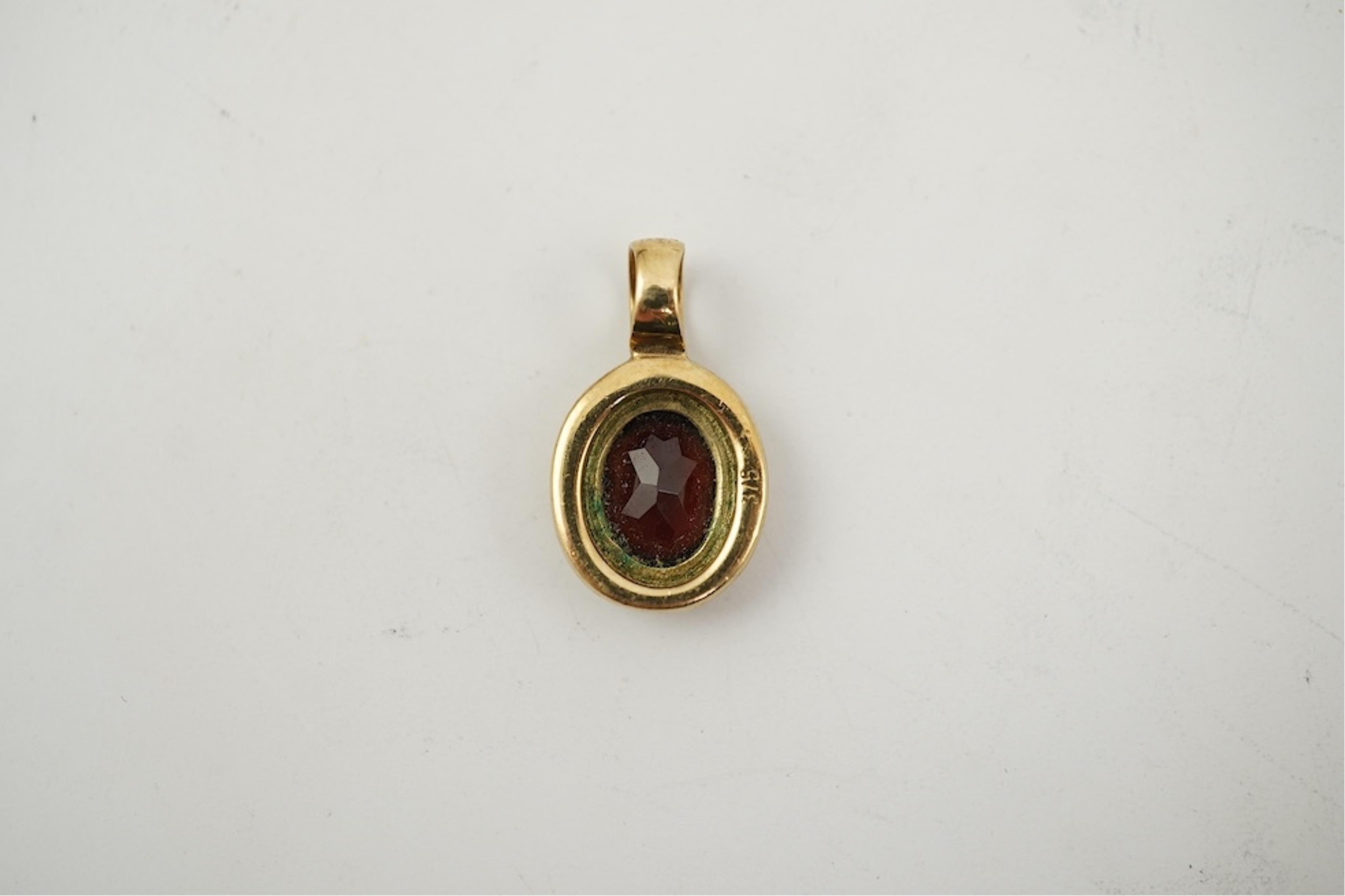 Five assorted modern 375 yellow metal and gem set pendants, a yellow metal and lapis lazuli set pendant (stamped 585?) 40mm, together with a yellow metal dragonfly brooch, a similar small pendant and a white metal bracel